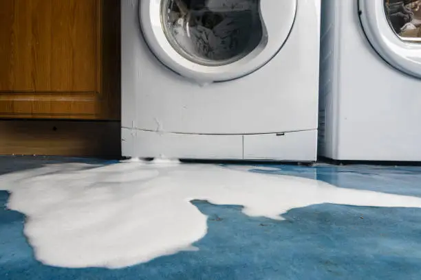 how o drain a washing machine manually